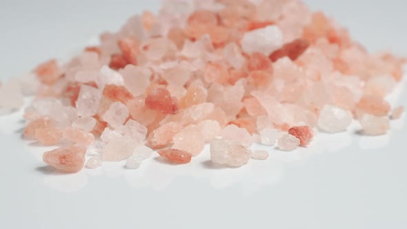 Rotation of raw Himalayan pink salt crystals. 