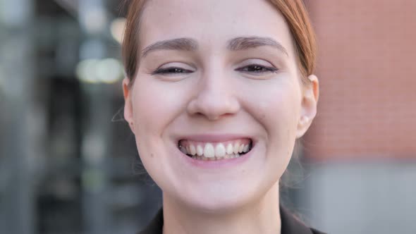 Close up of Smiling Young Woman Face