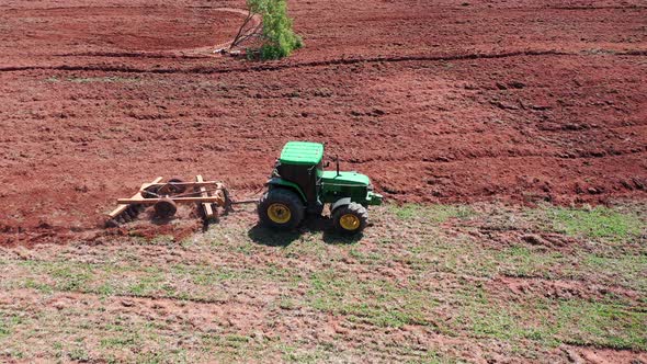 Tractor at rural landscape aerial view. Nature scenery