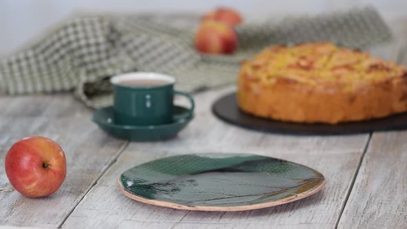 Piece of Tasty Homemade Apple Cake on Wooden Background Close Up