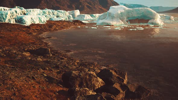 Antarctic Icebergs Near Rocky Beach