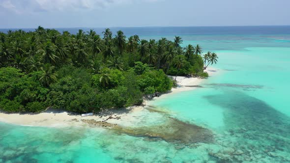 Beautiful above travel shot of a white sand paradise beach and aqua blue water background in colourf