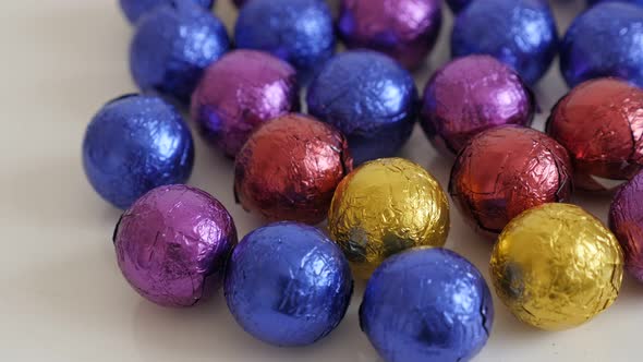 Colorful Christmas chocolate treats close-up  3840X2160 UltraHD tilting footage - Assorted round can