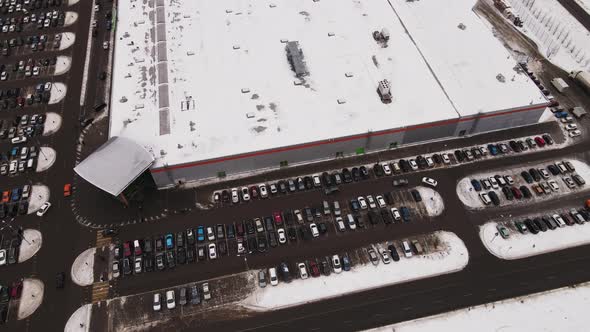 A Large Number of Cars are in Straight Rows in the Parking Lot Aerial View