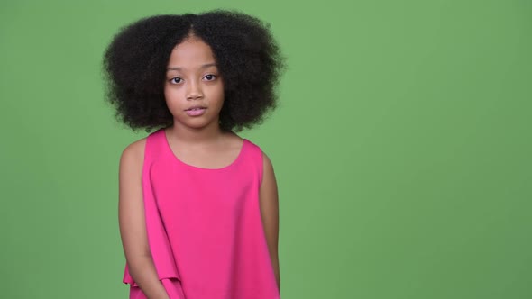 Young Cute African Girl with Afro Hair Talking To Camera