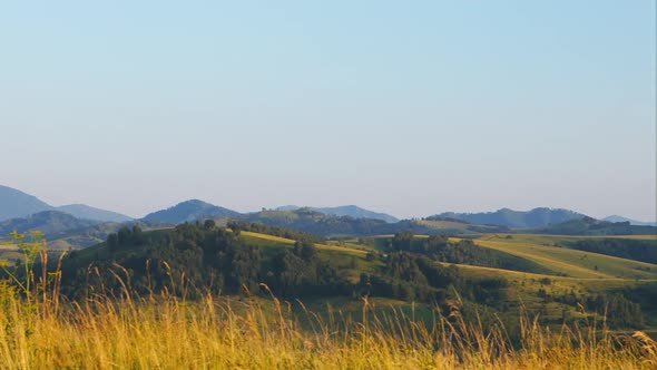 Panoramic view of scenic hills is on a sunset in Altay, Russia