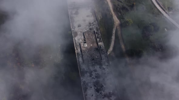 Aerial Shot Through The Fog Of An Abandoned Building - 4K