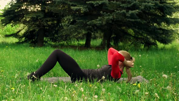 Twisting The Body Lying On The Back Outdoor