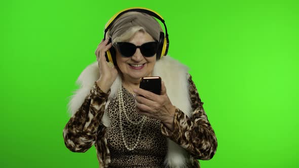 Elderly Grandmother. Caucasian Woman. Dance, Celebrate, Listen Music. Chroma Key