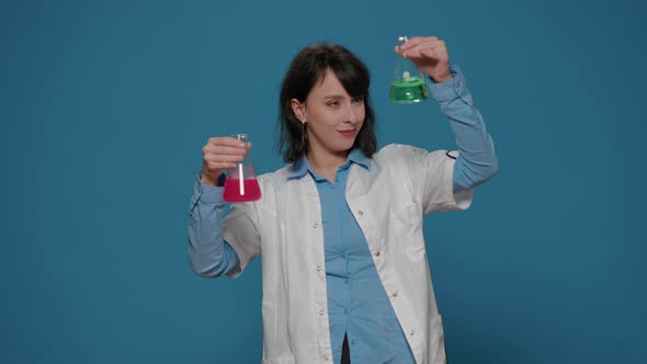 Scientific Specialist Analyzing Liquid Formula in Glass Beaker