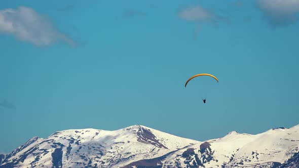 Paragliding Over the Snowcapped Caucasus Mountains Georgia