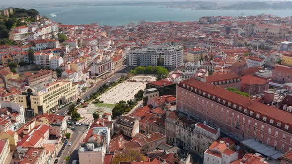 Aerial Orbit of Lisbon City Center with Traditional Colorful Houses Around Martim Moniz Square