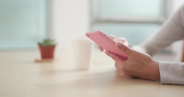 Woman sending sms on cellphone