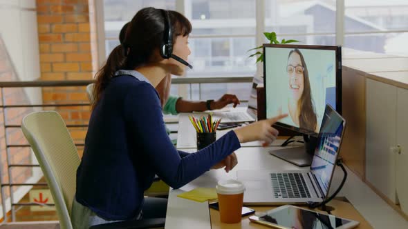 Businesswoman making video call on computer in a modern office 4k