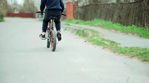 Active Child Riding Bike. Little Boy Cycling On Bicycle. Leisure Lifestyle Biking Recreation Ride.