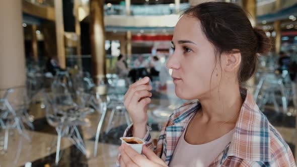 Woman Eating French Fries with Tomato Sauce, Unhealthy and Delicious Fast Food, Close-up.