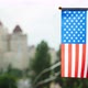 Flag of the United States of America set against blue sky, city street and buildings. Stars - VideoHive Item for Sale