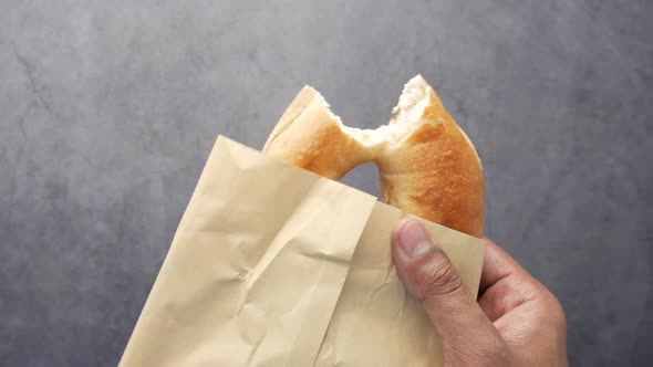 Fresh Bagel Bread in a Paper on Table