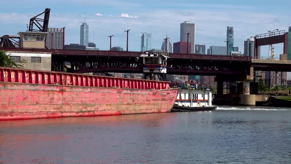 tug boat pushing barge under bridge city skyline 4k