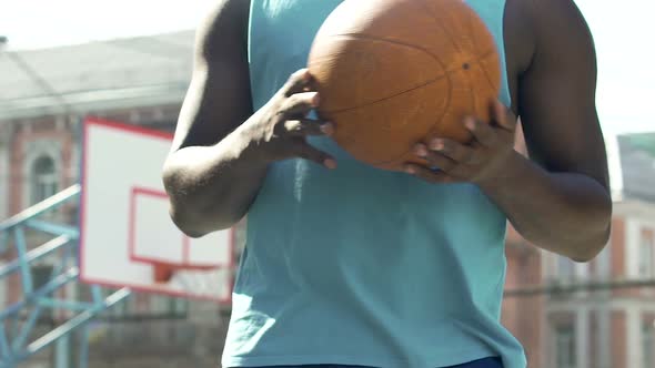 Black Basketball Trainer Playing With Ball, Preparing Team for Competition