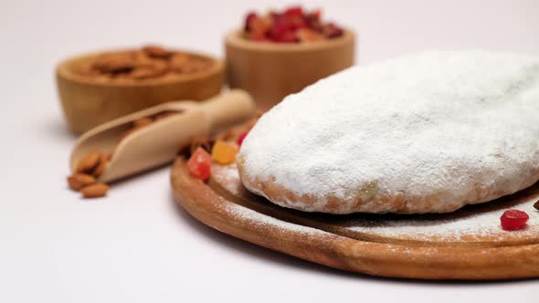 Traditional Christmas Stollen Cake with Marzipan and Dried Fruit Isolated on White Background