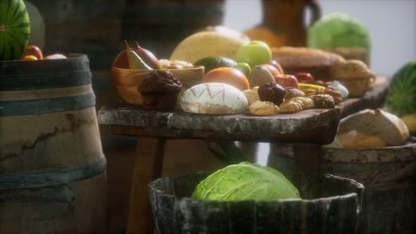 Food Table with Wine Barrels and Some Fruits Vegetables and Bread
