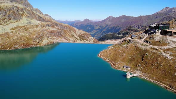 Berghotel Rudolfshutte Overlooking Weisssee Lake And Reservoir With Tranquil Waters At Daytime In Au