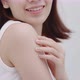 Close up shot Beautiful Asian woman applying moisturizer cream on her shoulder and arm gently. - VideoHive Item for Sale