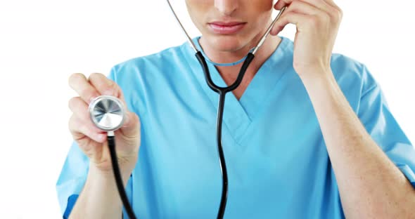 Close-up of male surgeon checking with stethoscope