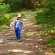 Cute Child Walking Alone in Green Forest - VideoHive Item for Sale