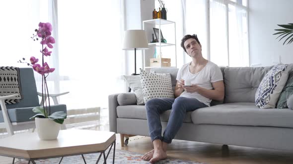 Pensive Man Drinking Coffee and Thinking Relaxing