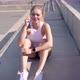 Female Jogger Resting on Steps - VideoHive Item for Sale