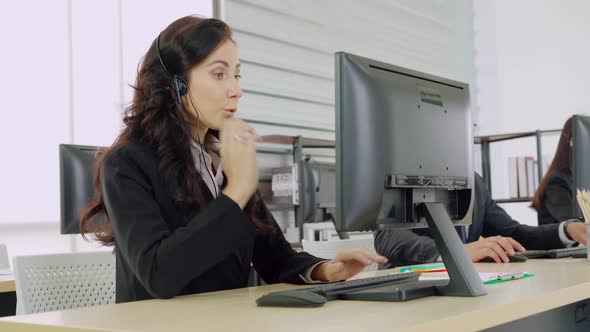 Business People Wearing Headset Working in Office