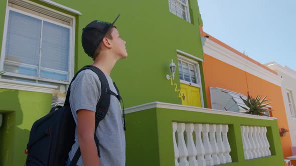 Boy Tourist in Cape Town BoKaap Malay Area Perspective of Cobble Stone Street Colored Terrace Houses