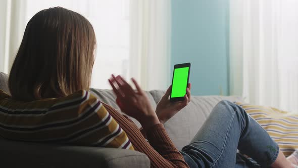 Girl Is Lying on the Couch and Talking on a Video Call