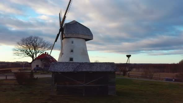 Old Araisi Windmill in Latvia Aerial Shot From Above. Winter Day at Sunrise 4K Video