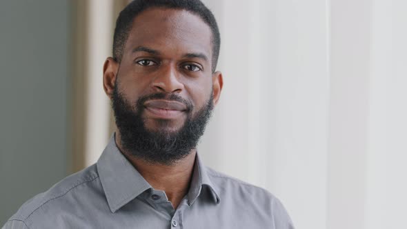 Smiling Bearded Millennial African Guy Professional Looking at Camera