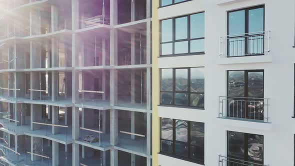 Construction site with monolith frames of new multi story buildings in fast-growing city