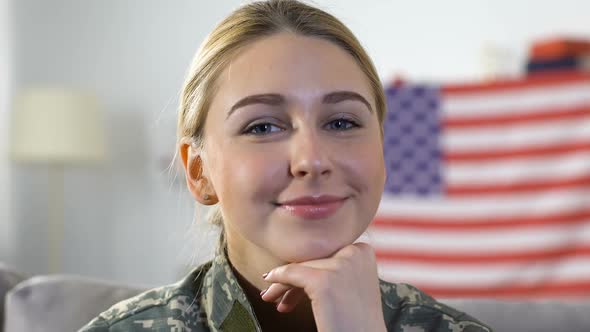 Young Pretty Woman in Military Uniform Looking Camera, America Flag Background