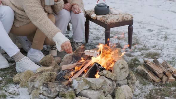 Close Up of a Women Hands That Roasted Marshmallow Outside