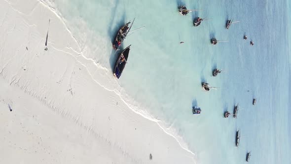 Tanzania Vertical Video  Boat Boats in the Ocean Near the Coast of Zanzibar Aerial View