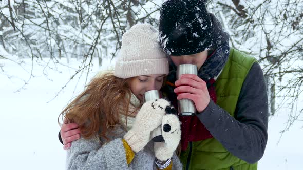 Couple Drinking Tea Coffee Cup in the Winter