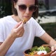 Woman Eating Poke Salad on Summer Cafe in Park - VideoHive Item for Sale