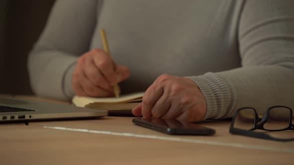 Close Up Wrinkled Male Hands Writing Information