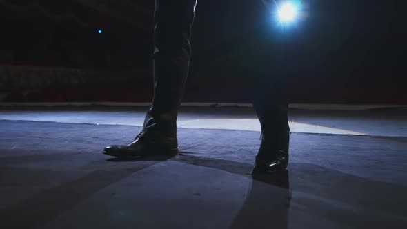 Actor's legs dancing on stage. 