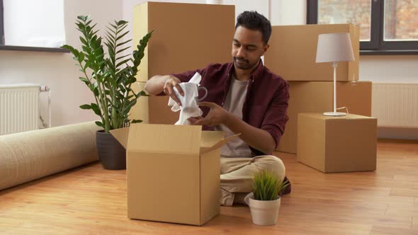 Indian Man Packing Boxes and Moving To New Home 2