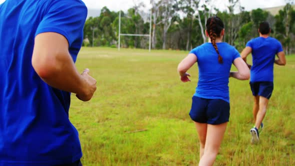 Fit people jogging in boot camp 4k