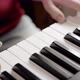 Close up of woman's hand playing on the electric piano. Female synthesizer player. - VideoHive Item for Sale