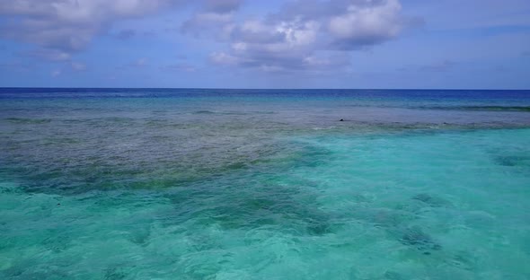 Beautiful drone copy space shot of a summer white paradise sand beach and blue ocean background 