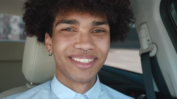 Smiling African American Millennial Professional Man Looking at Camera